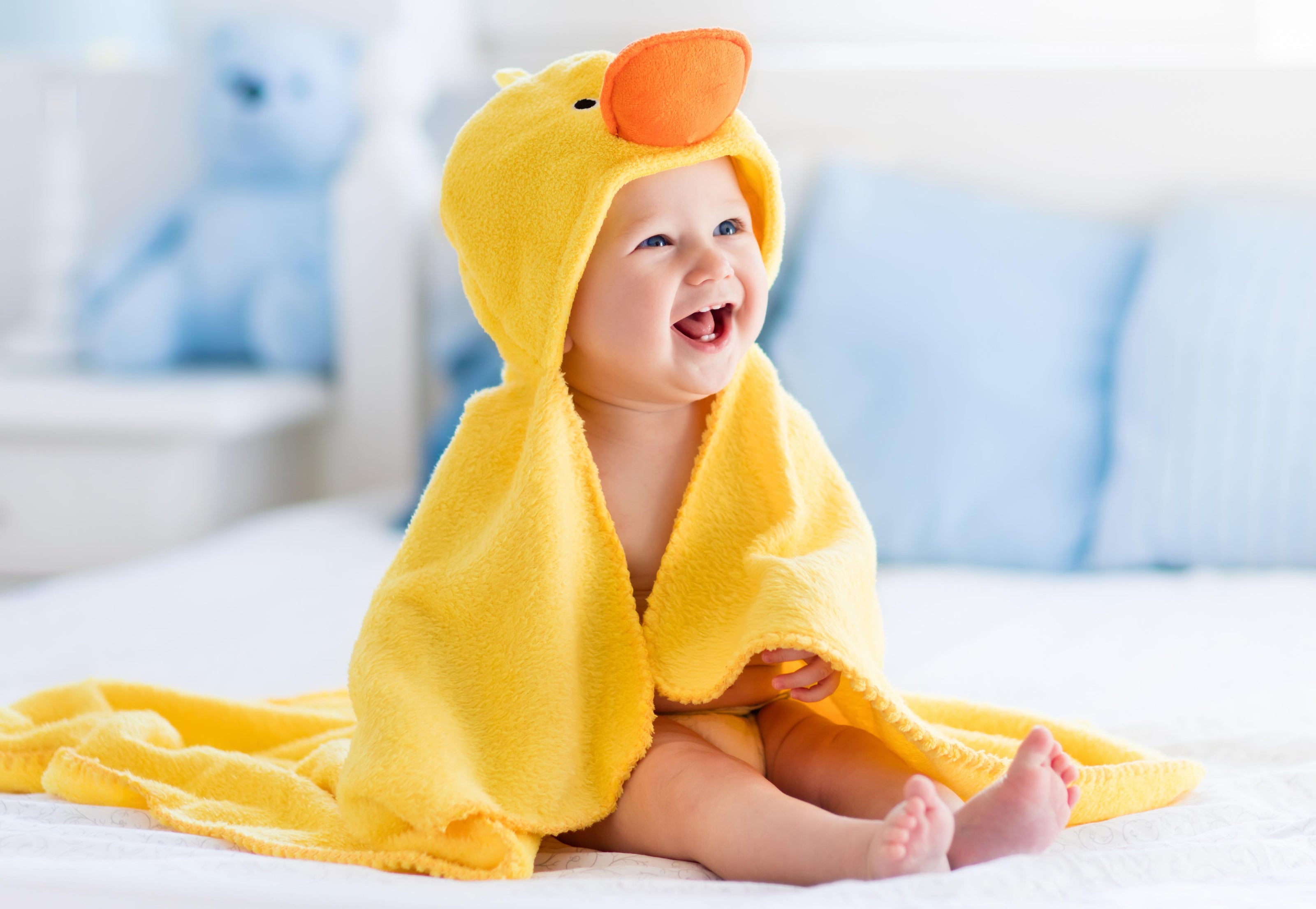 sitting baby with duck towel